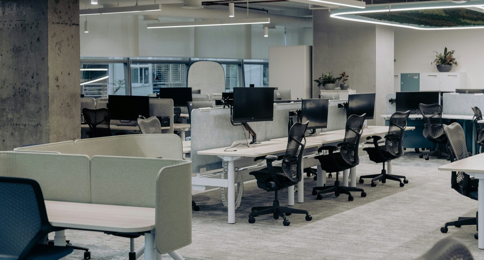 Professional office workspace with masonry samples, technical drawings, and restoration documentation