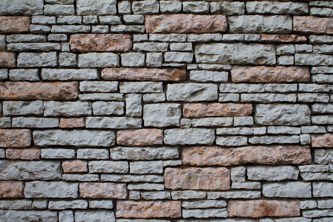 Close-up detail of stone masonry showing mortar joints and surface texture